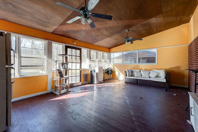 unfurnished sunroom featuring a ceiling fan, lofted ceiling, and wooden ceiling