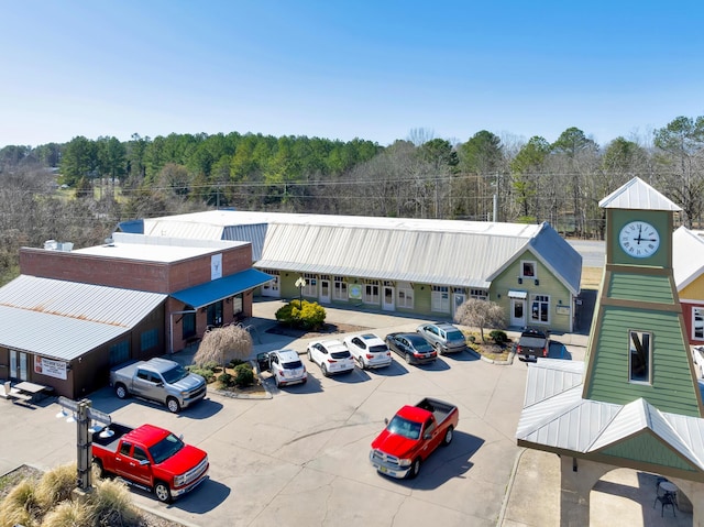 exterior space featuring a forest view