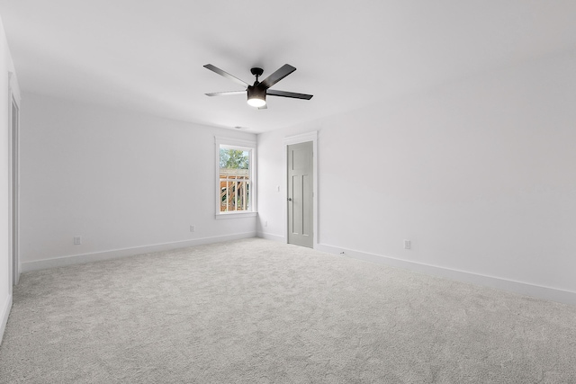 unfurnished room with carpet, baseboards, and a ceiling fan