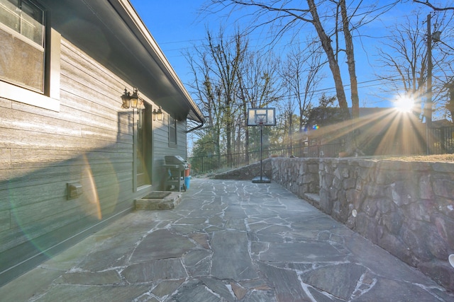 view of patio / terrace featuring fence