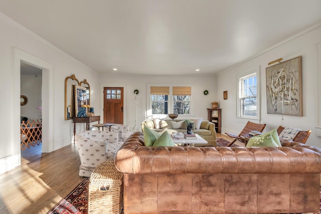 living room featuring ornamental molding, recessed lighting, baseboards, and wood finished floors