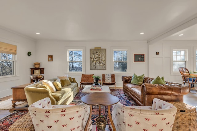 living room with ornamental molding, recessed lighting, baseboards, and wood finished floors