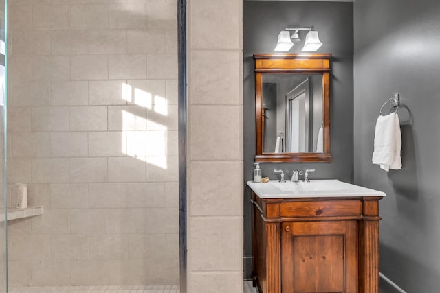 full bath featuring a shower stall and vanity