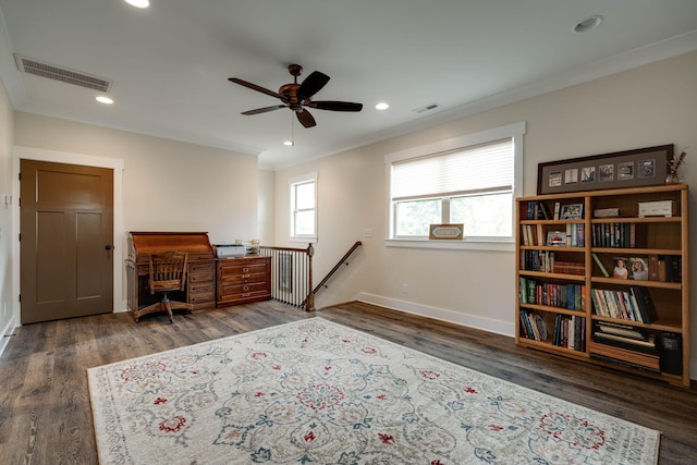 office area with ornamental molding, wood finished floors, and visible vents