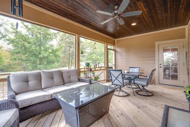 sunroom with wooden ceiling and a ceiling fan