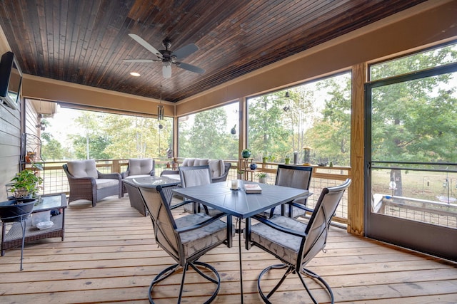 wooden deck with outdoor dining area, an outdoor living space, and a ceiling fan