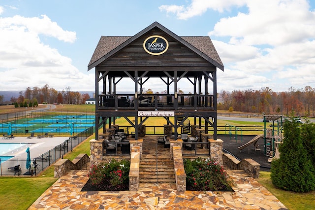 exterior space with a gazebo and fence