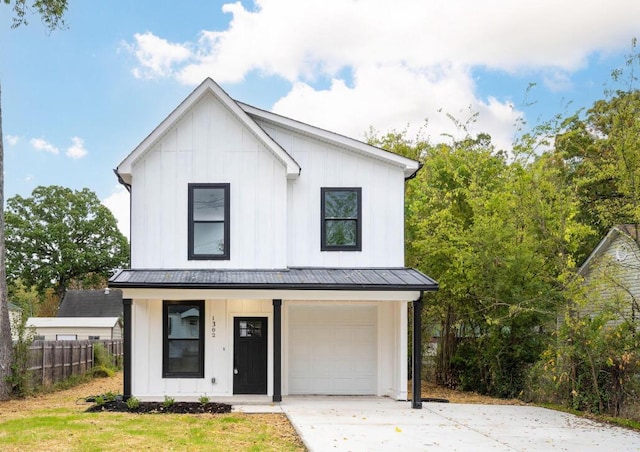 modern inspired farmhouse with a standing seam roof, fence, a porch, and board and batten siding