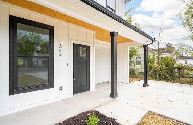 view of exterior entry featuring board and batten siding