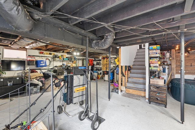 unfinished basement featuring stairs