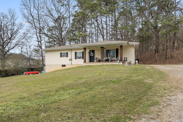 single story home featuring a porch and a front lawn