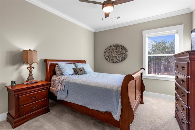 bedroom featuring crown molding, baseboards, visible vents, and light carpet