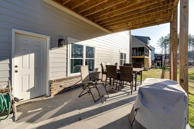view of patio featuring outdoor dining space and grilling area
