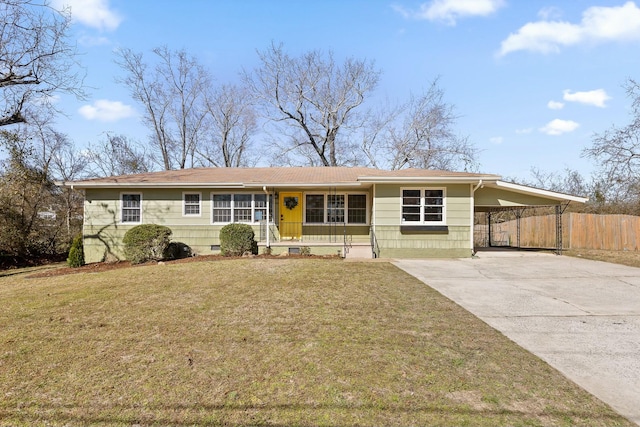 ranch-style house with concrete driveway, an attached carport, crawl space, fence, and a front lawn