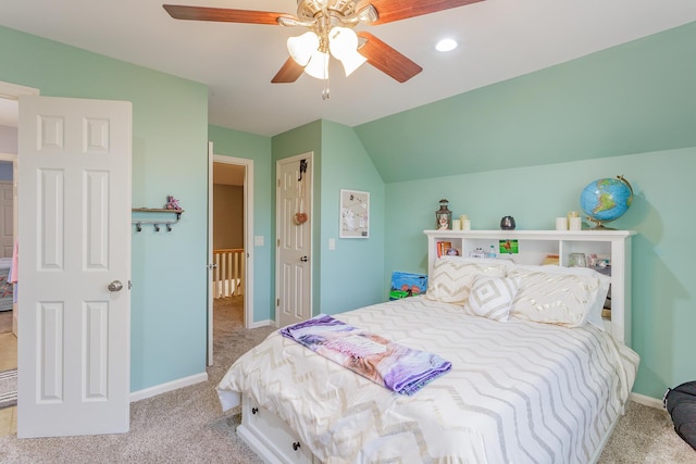 bedroom featuring vaulted ceiling, ceiling fan, carpet flooring, and baseboards