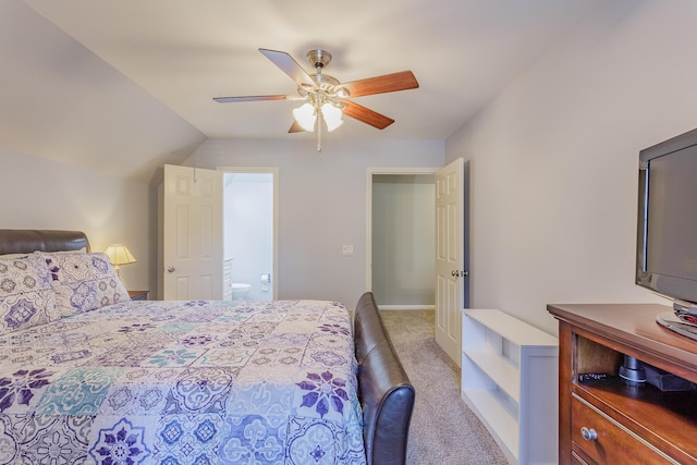 bedroom featuring carpet, ceiling fan, lofted ceiling, and ensuite bathroom