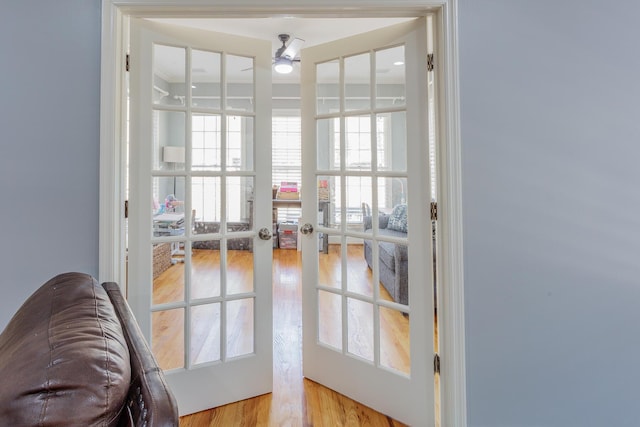 entryway featuring french doors, ceiling fan, and wood finished floors