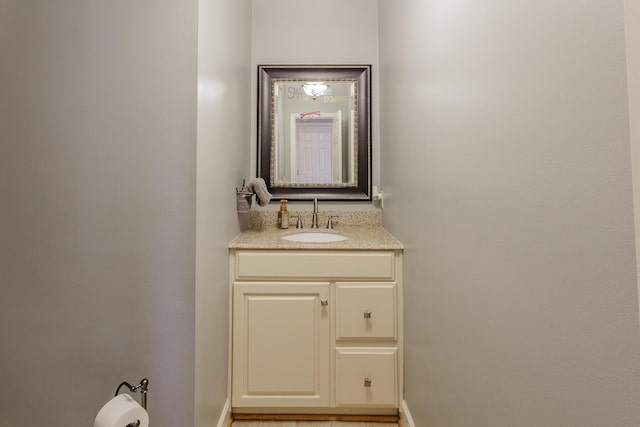 bathroom featuring vanity and baseboards