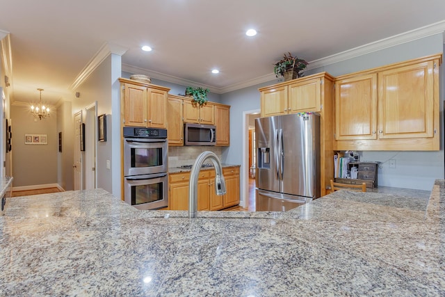 kitchen featuring crown molding, stainless steel appliances, decorative backsplash, and light stone countertops