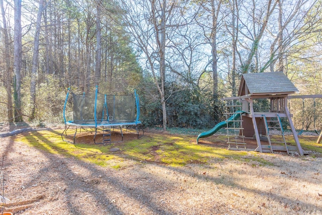 view of playground with a trampoline and a lawn