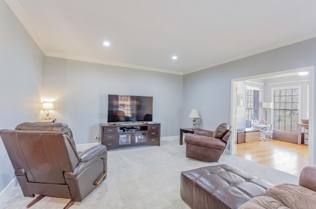 living room featuring baseboards, recessed lighting, light carpet, and crown molding