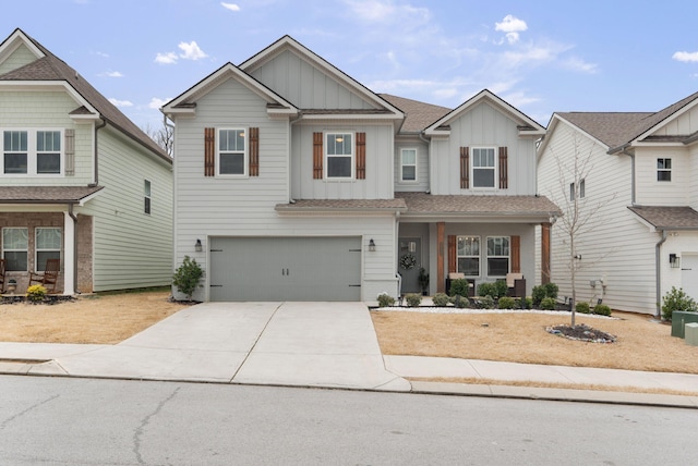 craftsman inspired home with a garage, driveway, board and batten siding, and roof with shingles