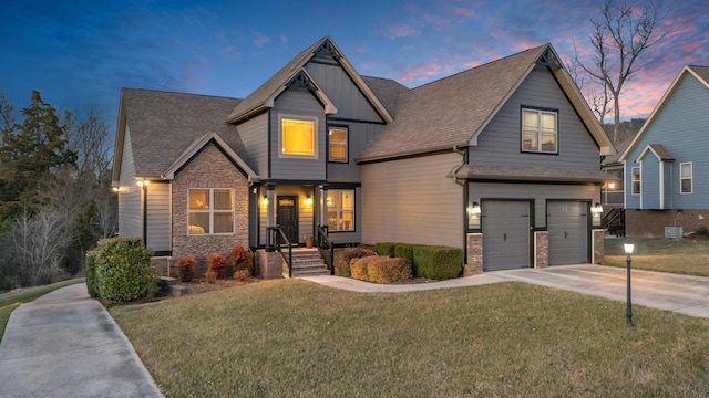 craftsman house with concrete driveway, stone siding, roof with shingles, an attached garage, and a front lawn