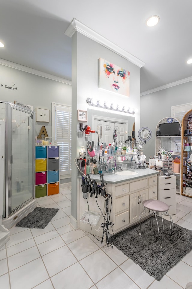 full bath featuring recessed lighting, vanity, ornamental molding, tile patterned floors, and a stall shower