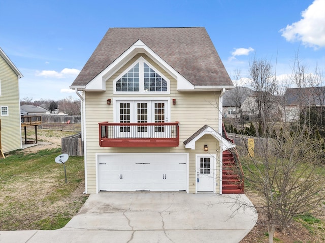 view of front of house featuring driveway, a shingled roof, a front lawn, and an attached garage