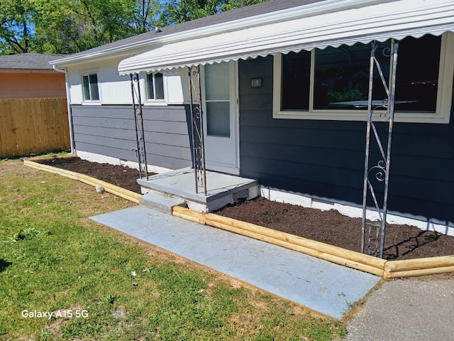 property entrance featuring fence