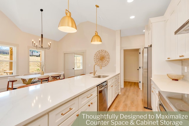 kitchen featuring stainless steel appliances, a sink, white cabinetry, light countertops, and light wood-type flooring