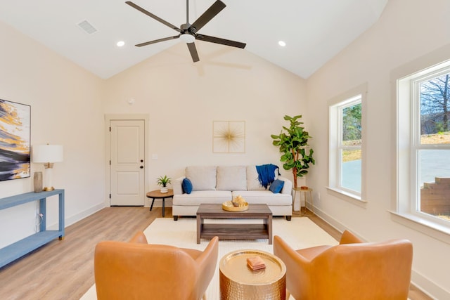 living room with light wood-style flooring, recessed lighting, visible vents, and baseboards