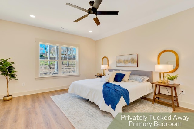 bedroom featuring recessed lighting, wood finished floors, and baseboards