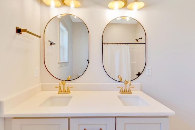 bathroom with a sink and double vanity