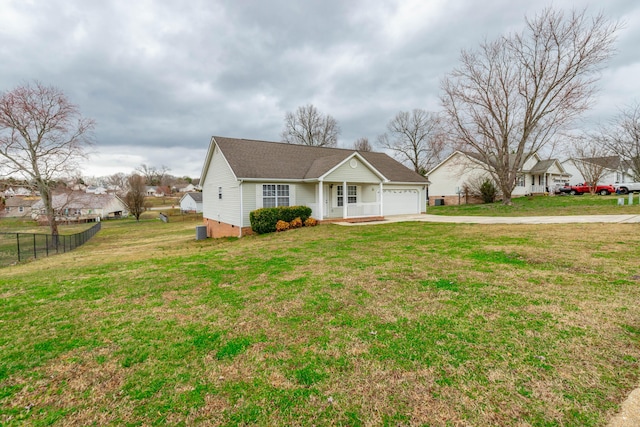 view of front facade featuring driveway, crawl space, an attached garage, fence, and a front lawn