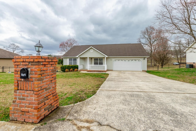 view of front of home featuring driveway, a garage, fence, a front lawn, and a porch