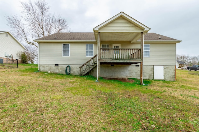 back of property featuring crawl space, stairway, a deck, and a lawn