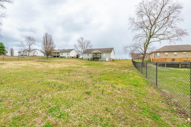 view of yard with a residential view and fence