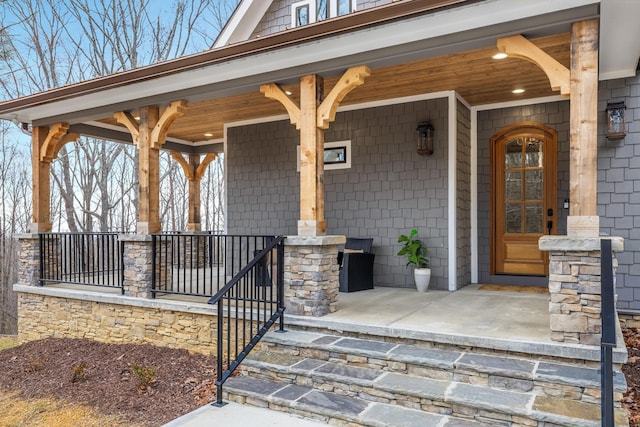 doorway to property featuring a porch