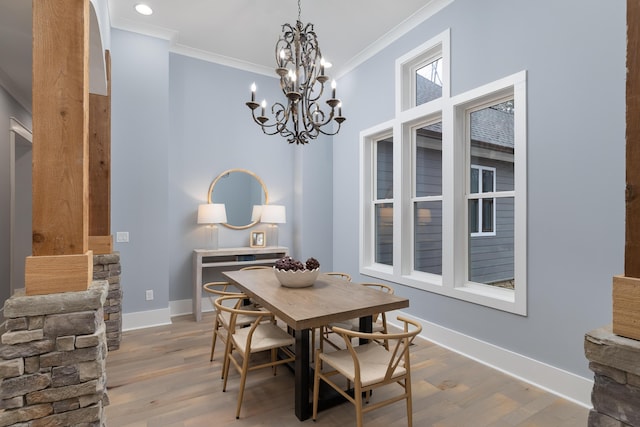 dining area with ornamental molding, light wood-type flooring, recessed lighting, and baseboards