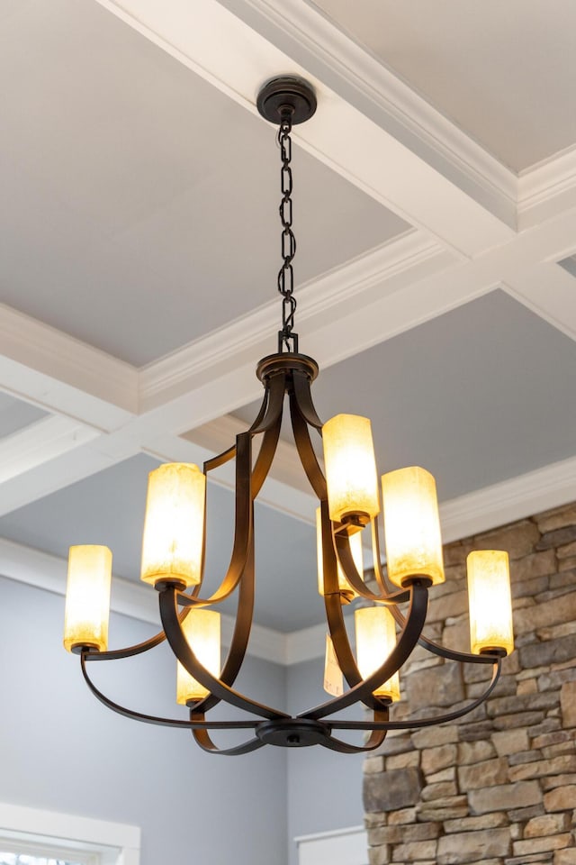 room details with a chandelier and crown molding