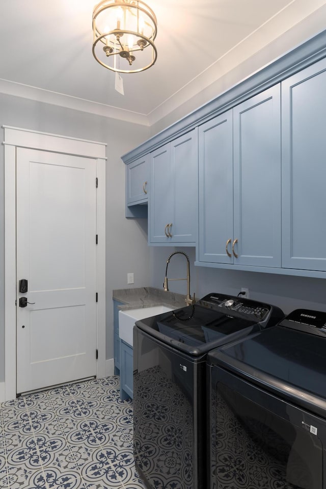 clothes washing area featuring light tile patterned floors, cabinet space, ornamental molding, a sink, and separate washer and dryer