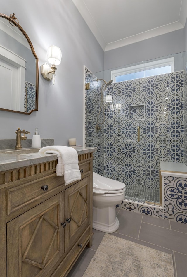 full bathroom featuring a walk in shower, tile patterned flooring, toilet, vanity, and ornamental molding