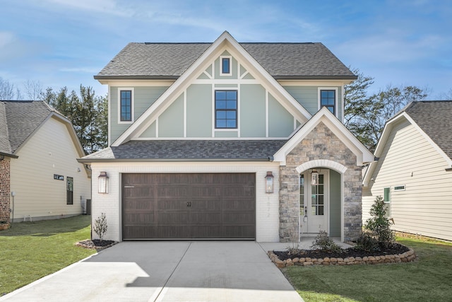 view of front facade featuring a garage, brick siding, concrete driveway, roof with shingles, and a front yard