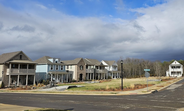 exterior space with a residential view and a front lawn