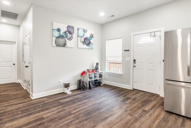 foyer featuring recessed lighting, visible vents, baseboards, and dark wood finished floors