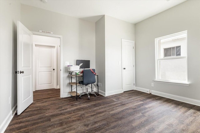 office featuring baseboards and dark wood-style flooring