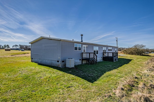 rear view of house with crawl space, a lawn, a deck, and cooling unit