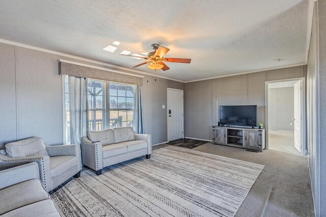 carpeted living room featuring ceiling fan, ornamental molding, and a textured ceiling