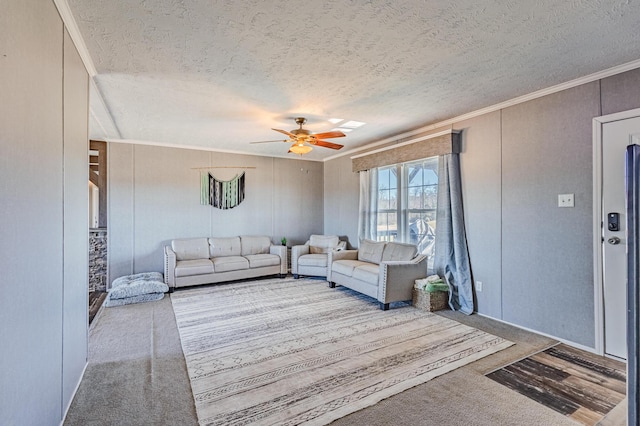 unfurnished living room featuring a textured ceiling, ornamental molding, a decorative wall, and a ceiling fan